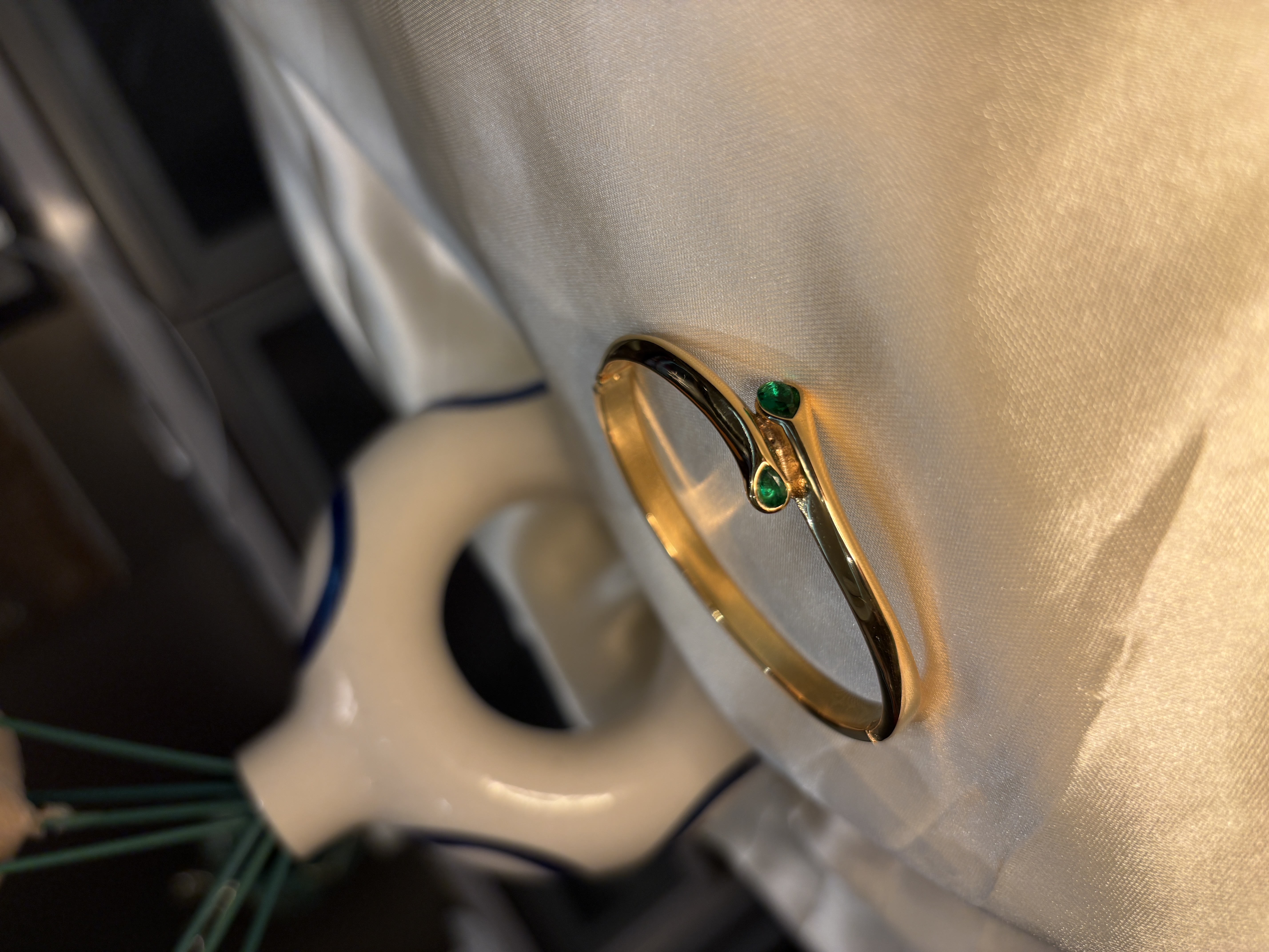 Elegant gold bracelet with green gemstones