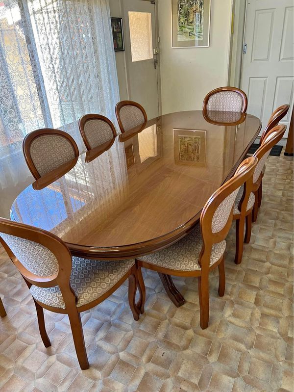 Wooden dining table with 8 chairs