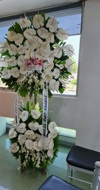 White Anthuriums, lilies & orchids Elegant Funeral Flower Stand