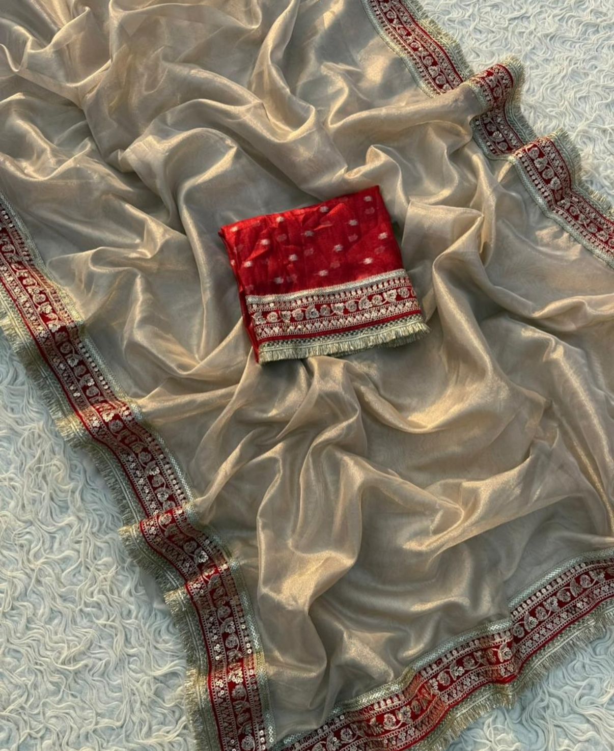 Glamorous Beige Tissue Silk Saree with Red Embroidered Border