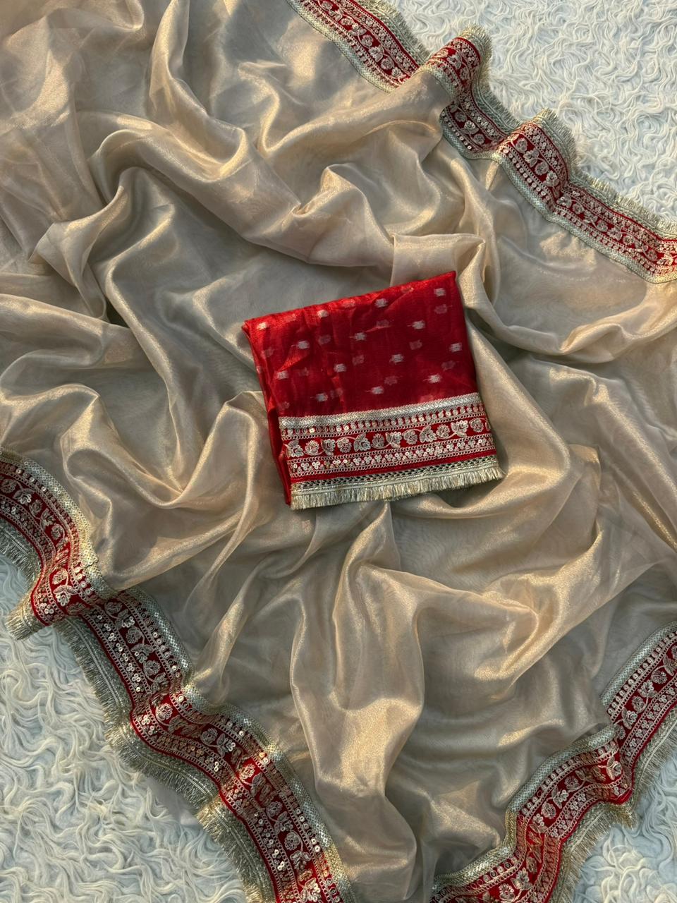Glamorous Beige Tissue Silk Saree with Red Embroidered Border