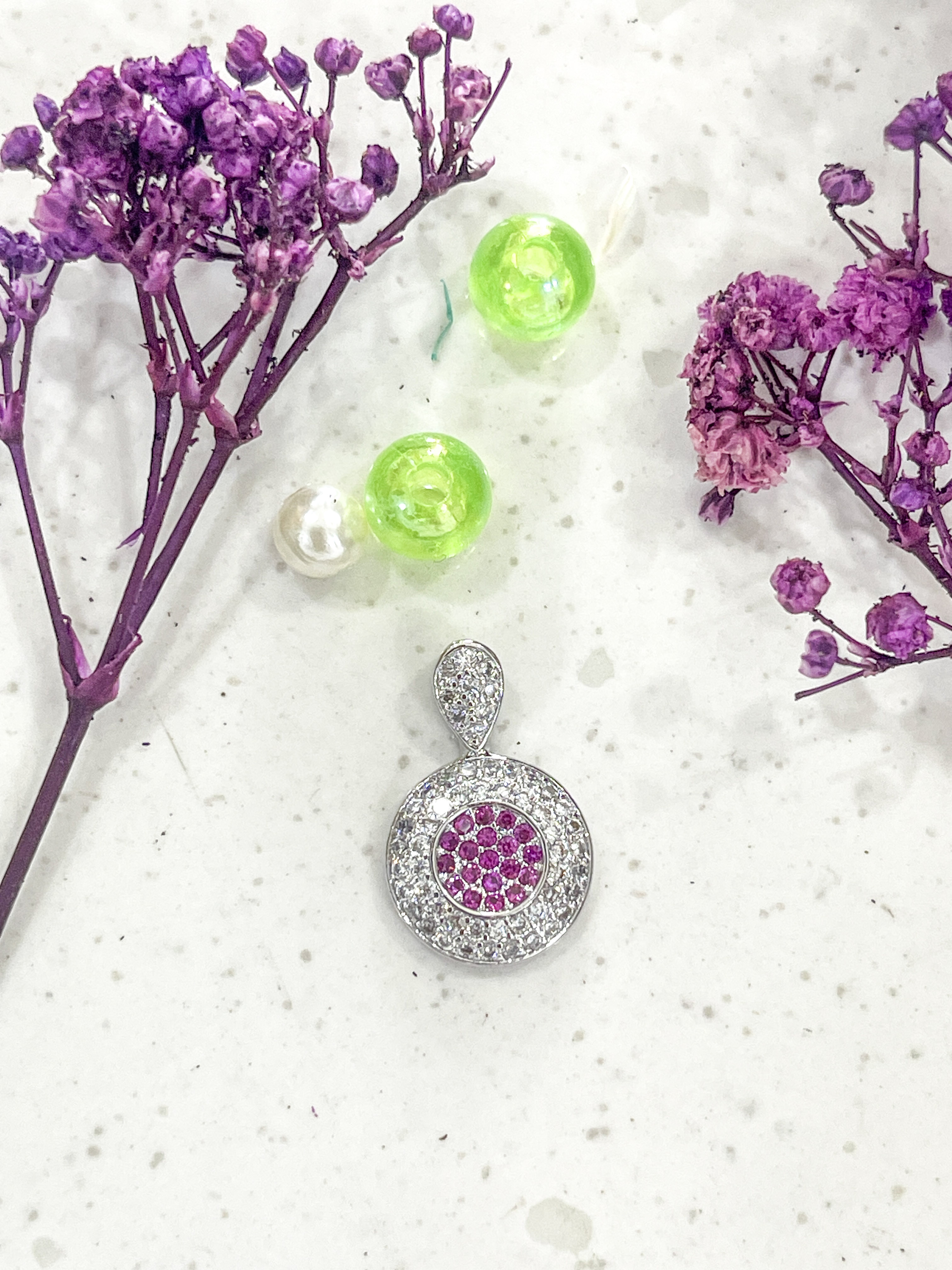 Elegant Round Pendant with Pink Gemstones