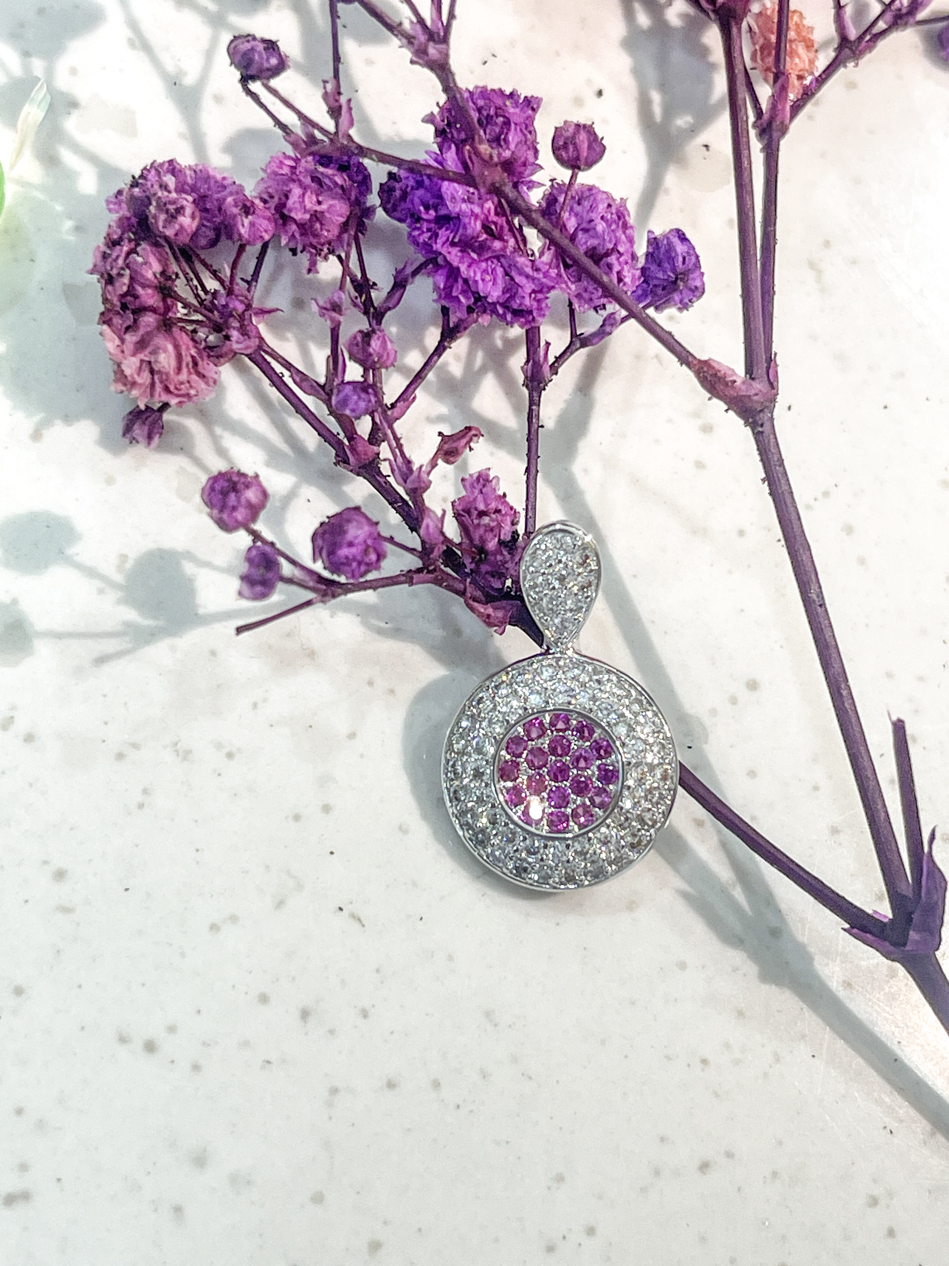 Elegant Round Pendant with Pink Gemstones