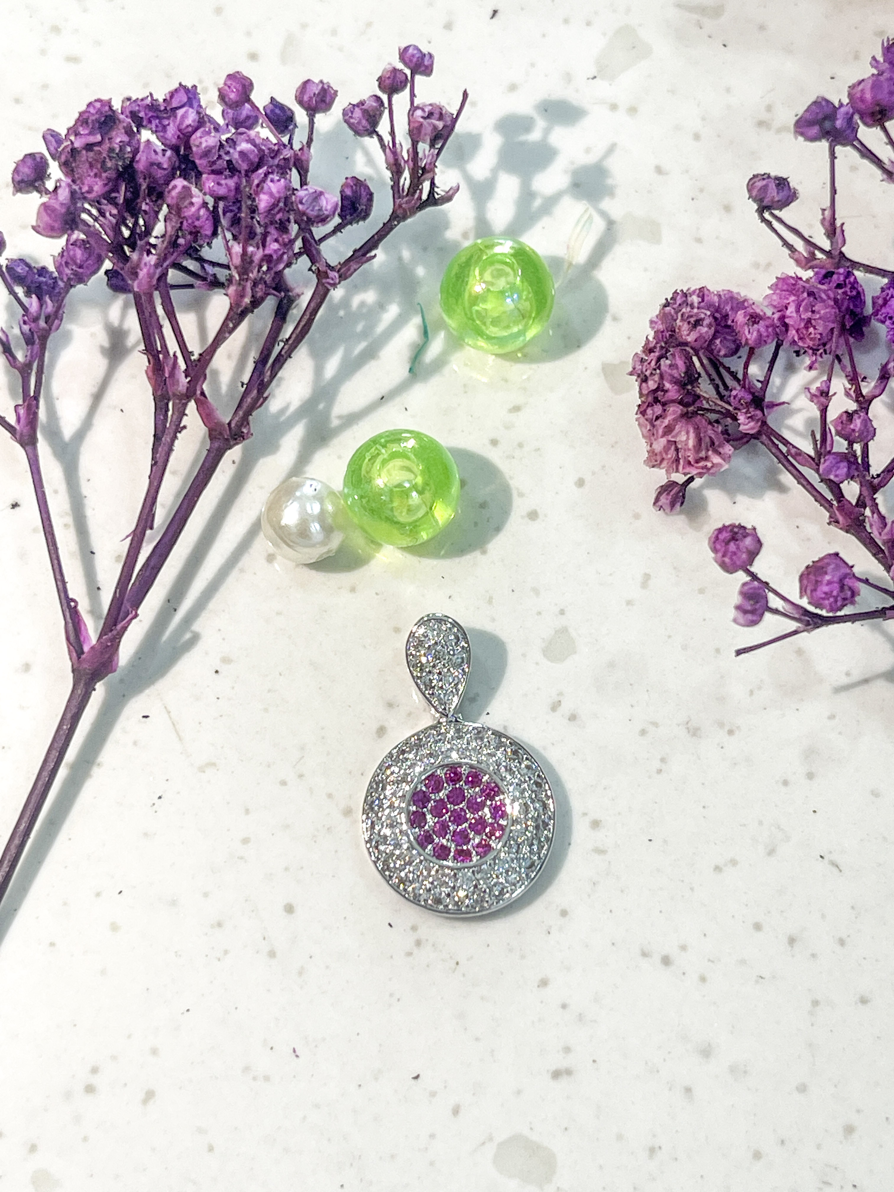 Elegant Round Pendant with Pink Gemstones