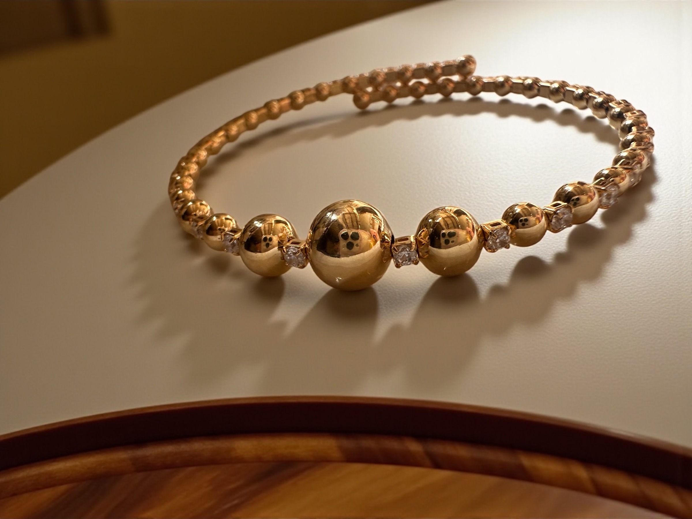 Pulseira de esferas douradas