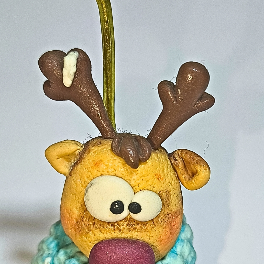 Portafoto artesanal Reno con bufanda azul