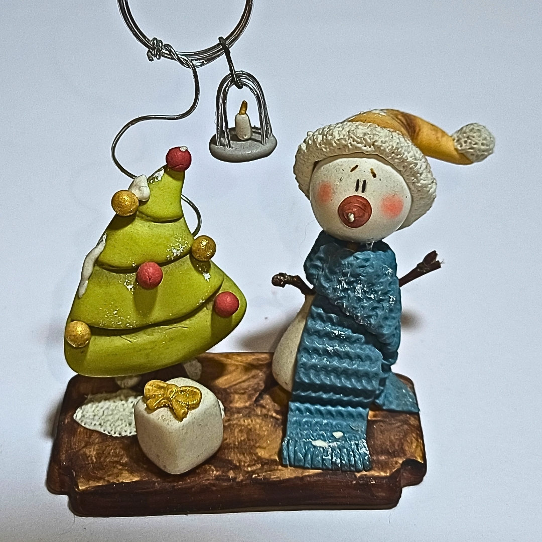 Portaretrato artesanal de muñeco de nieve y árbol de Navidad