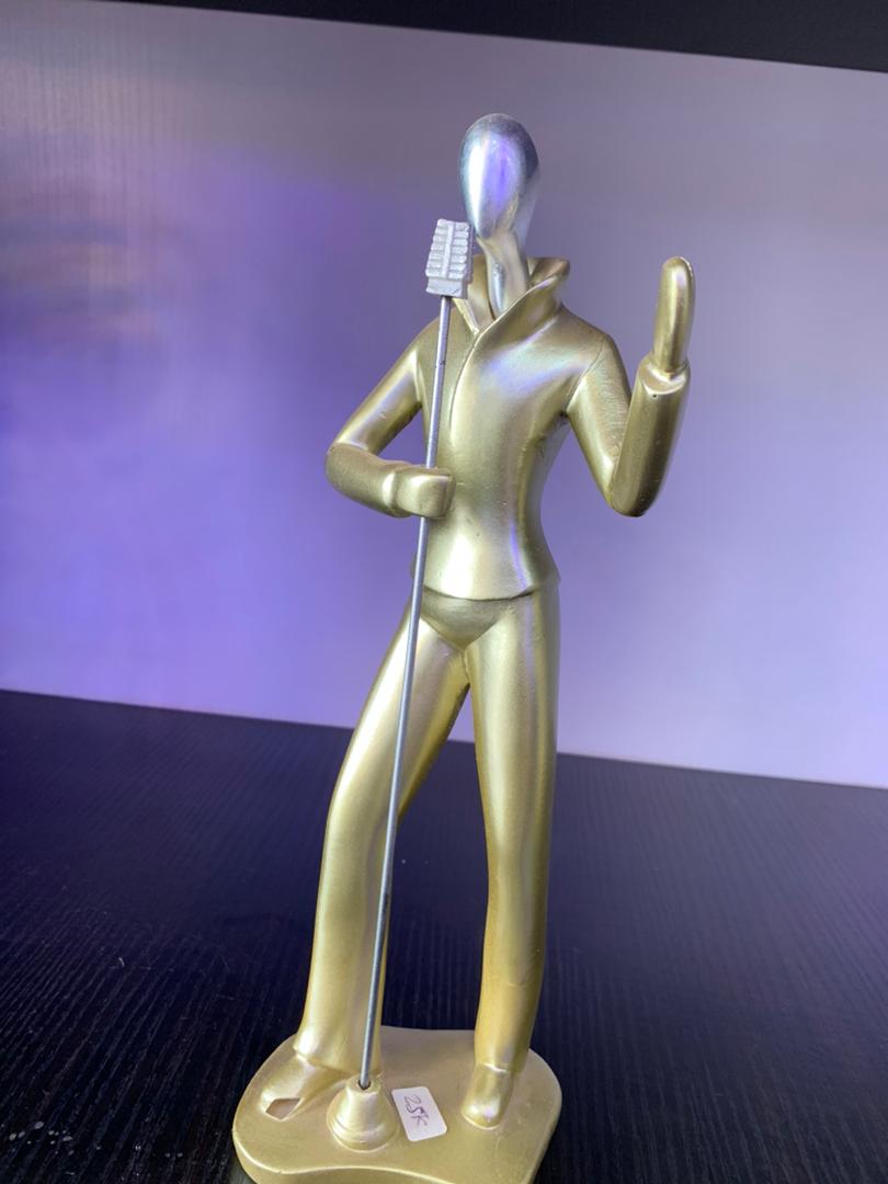 Golden Singer Figurine