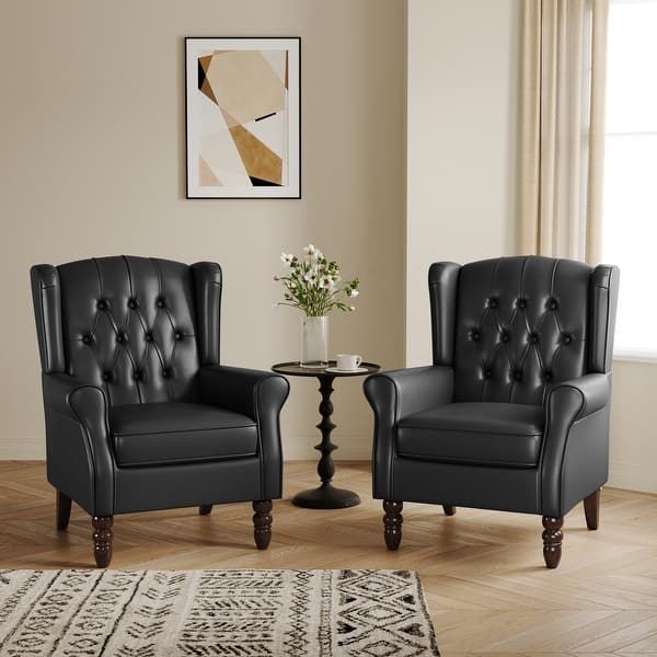 Black Leather Tuffed Armchairs