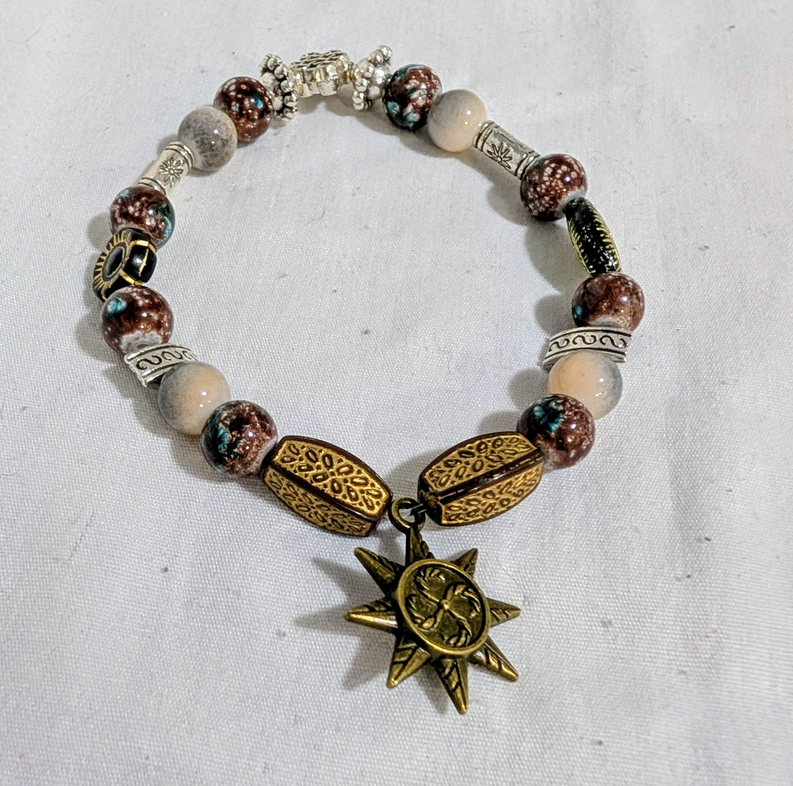 Golden Beaded Bracelet with Sun Pendant