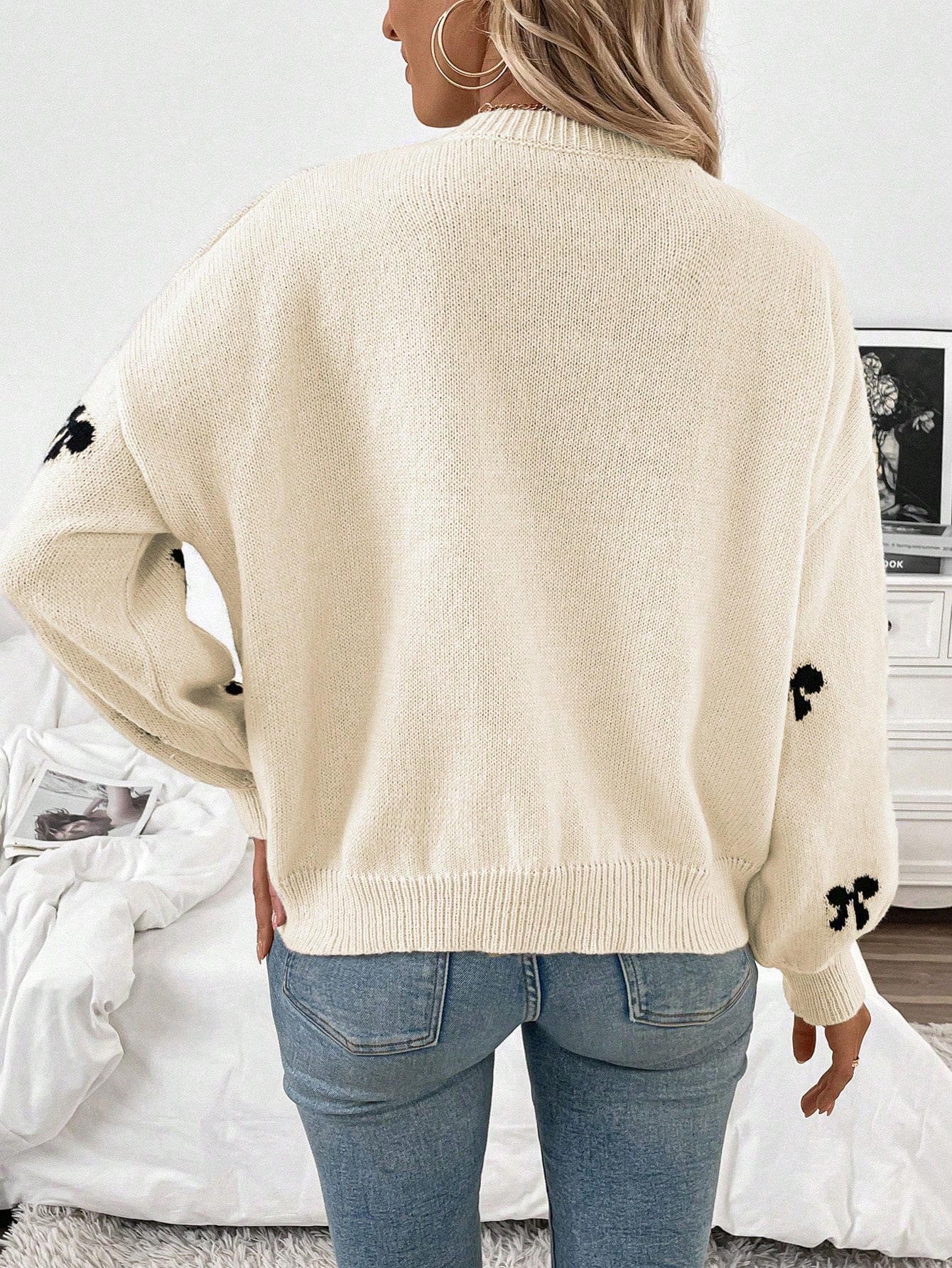 White Sweater with Black Bow Pattern