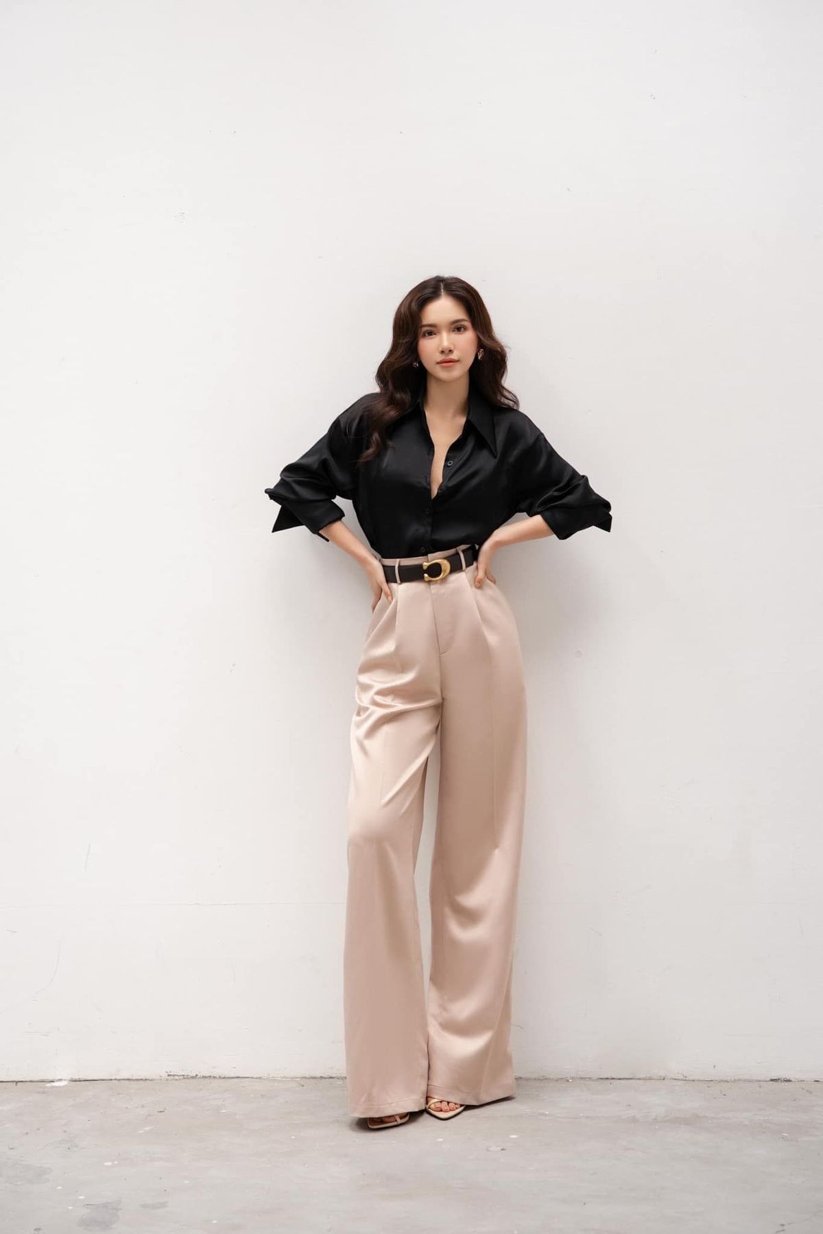 High-waisted beige wide-leg trousers