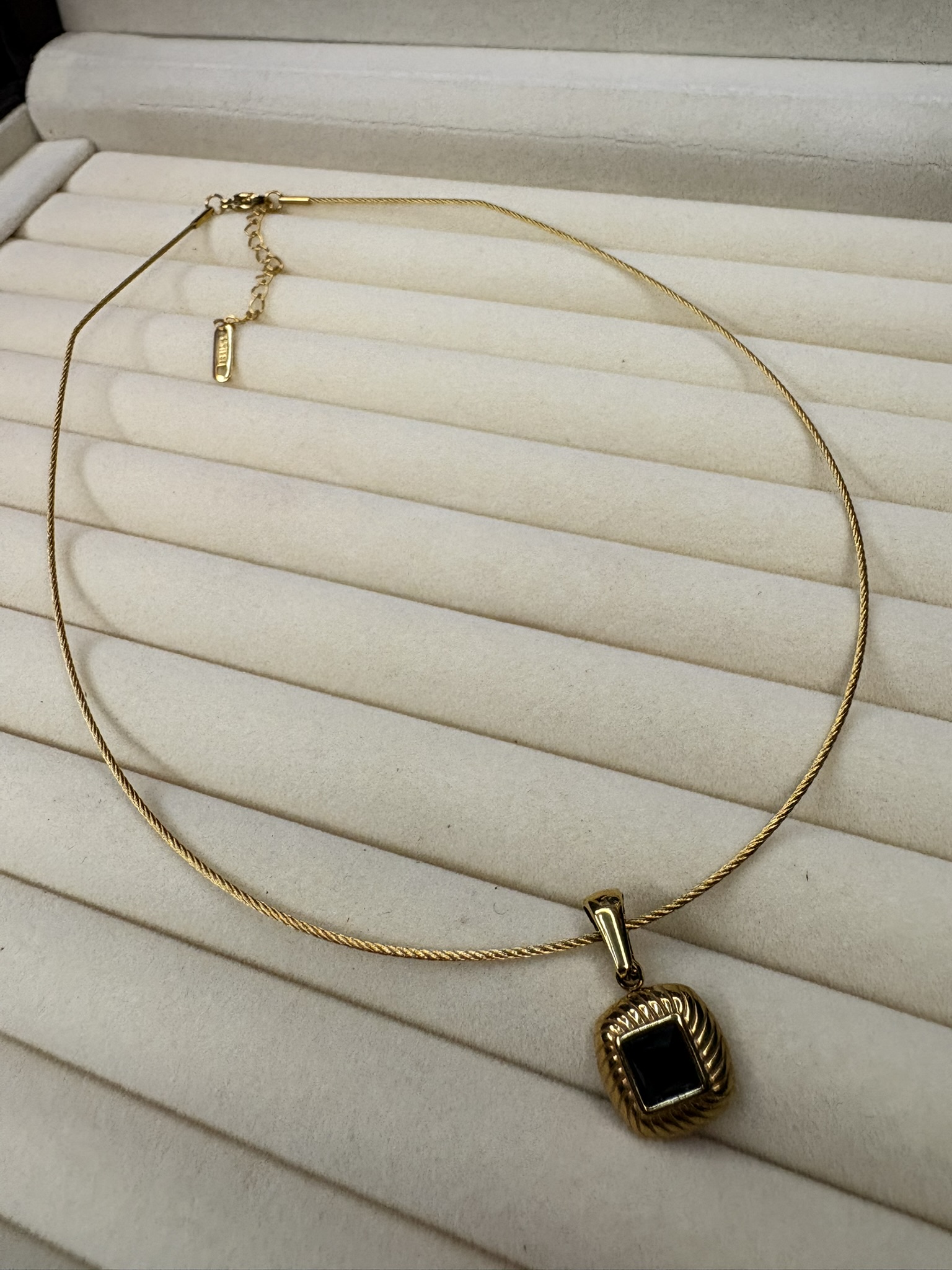 Elegant Gold Necklace with Black Stone Pendant