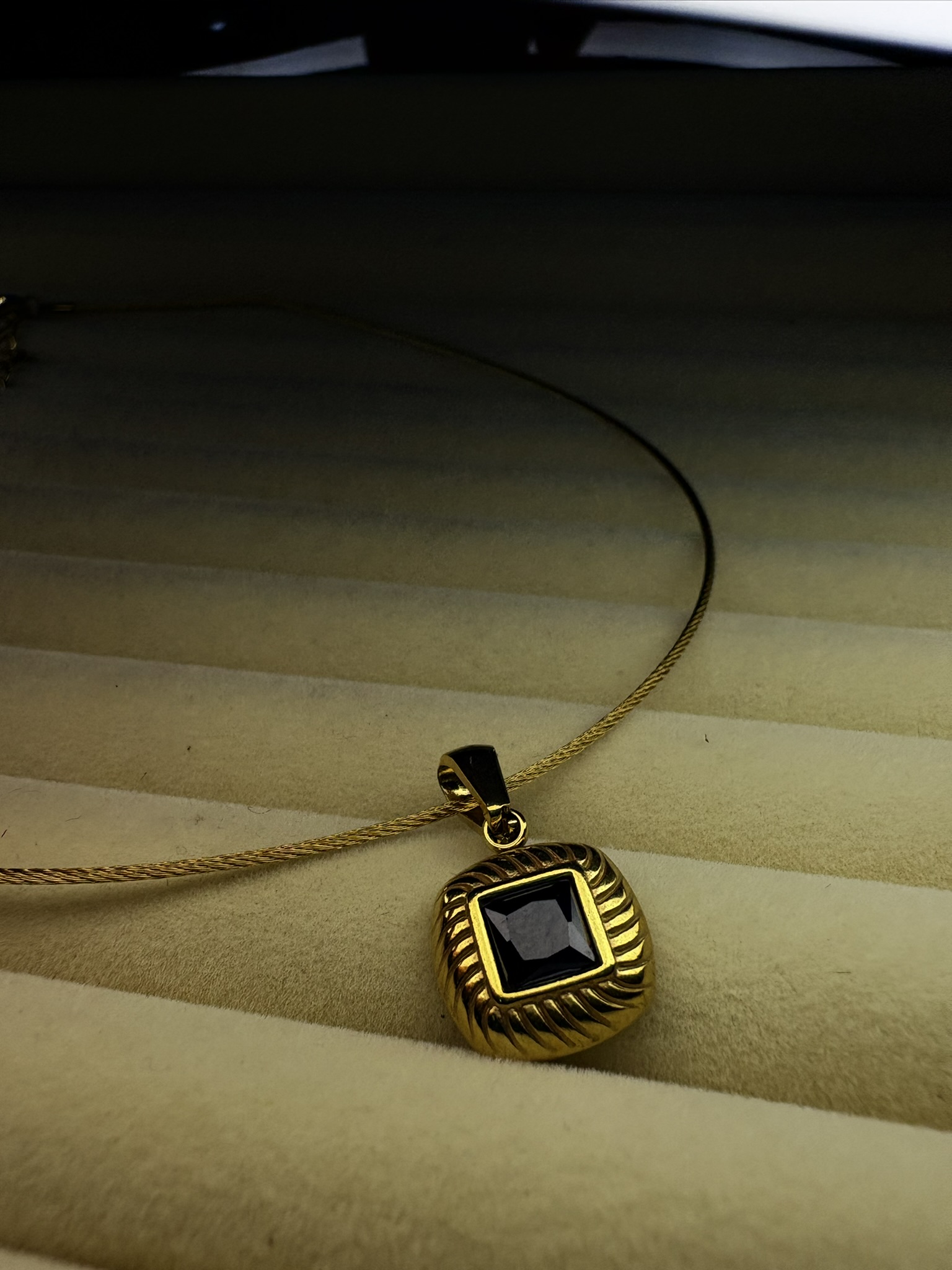 Elegant Gold Necklace with Black Stone Pendant