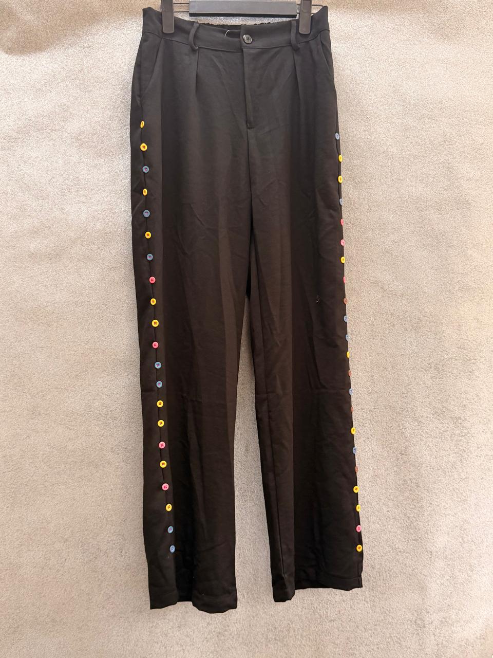 Black pants with decorative side buttons