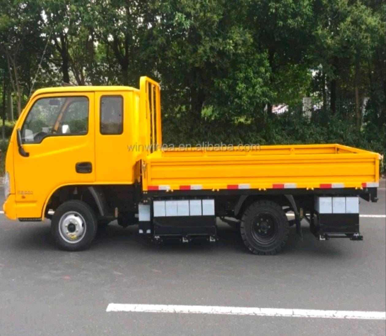 Yellow flatbed cargo truck