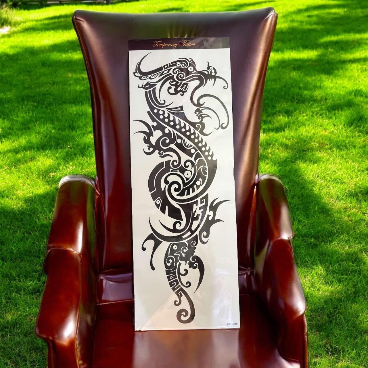 Tribal Dragon full arm tattoo
