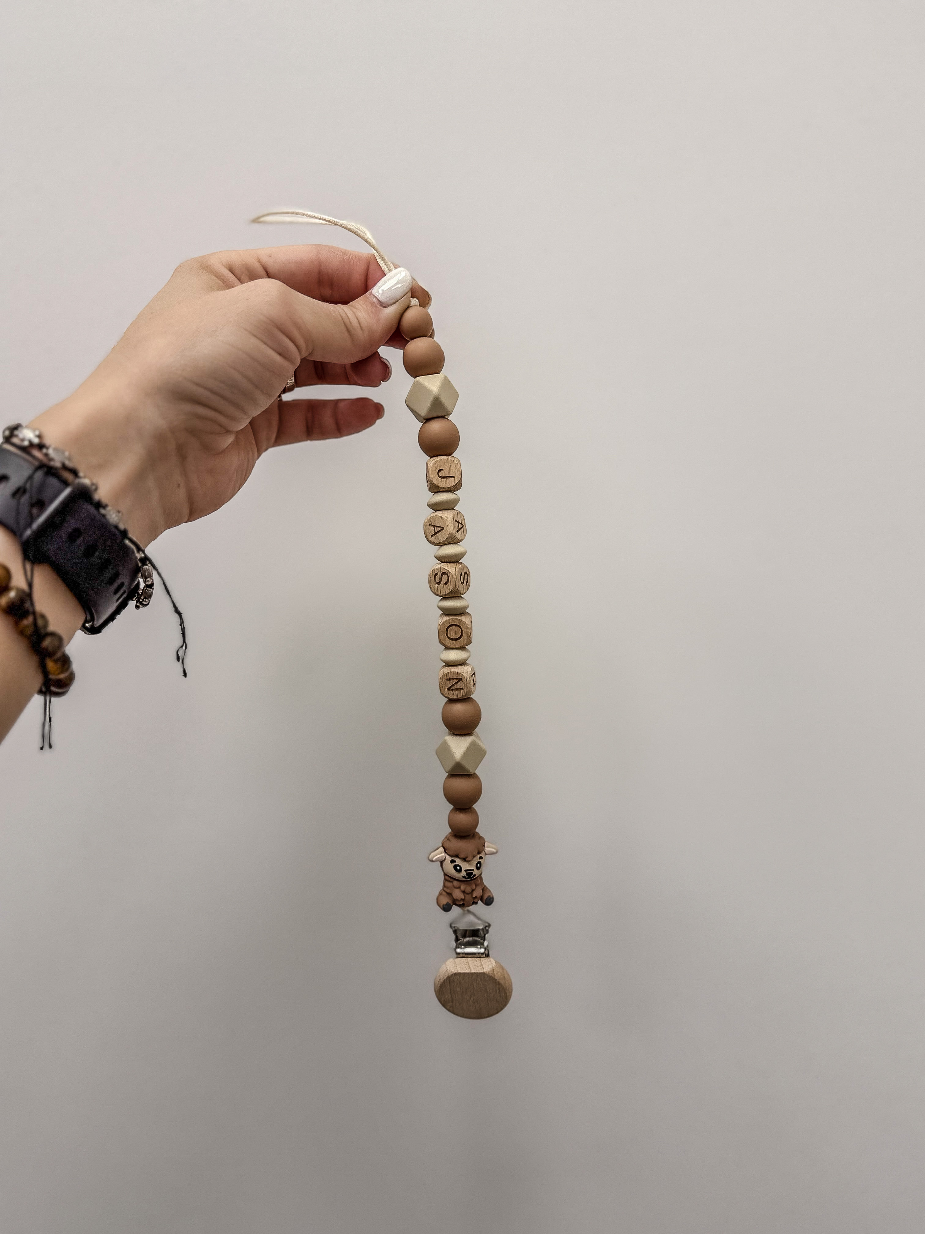 Čiulptuko laikiklis su vardu 