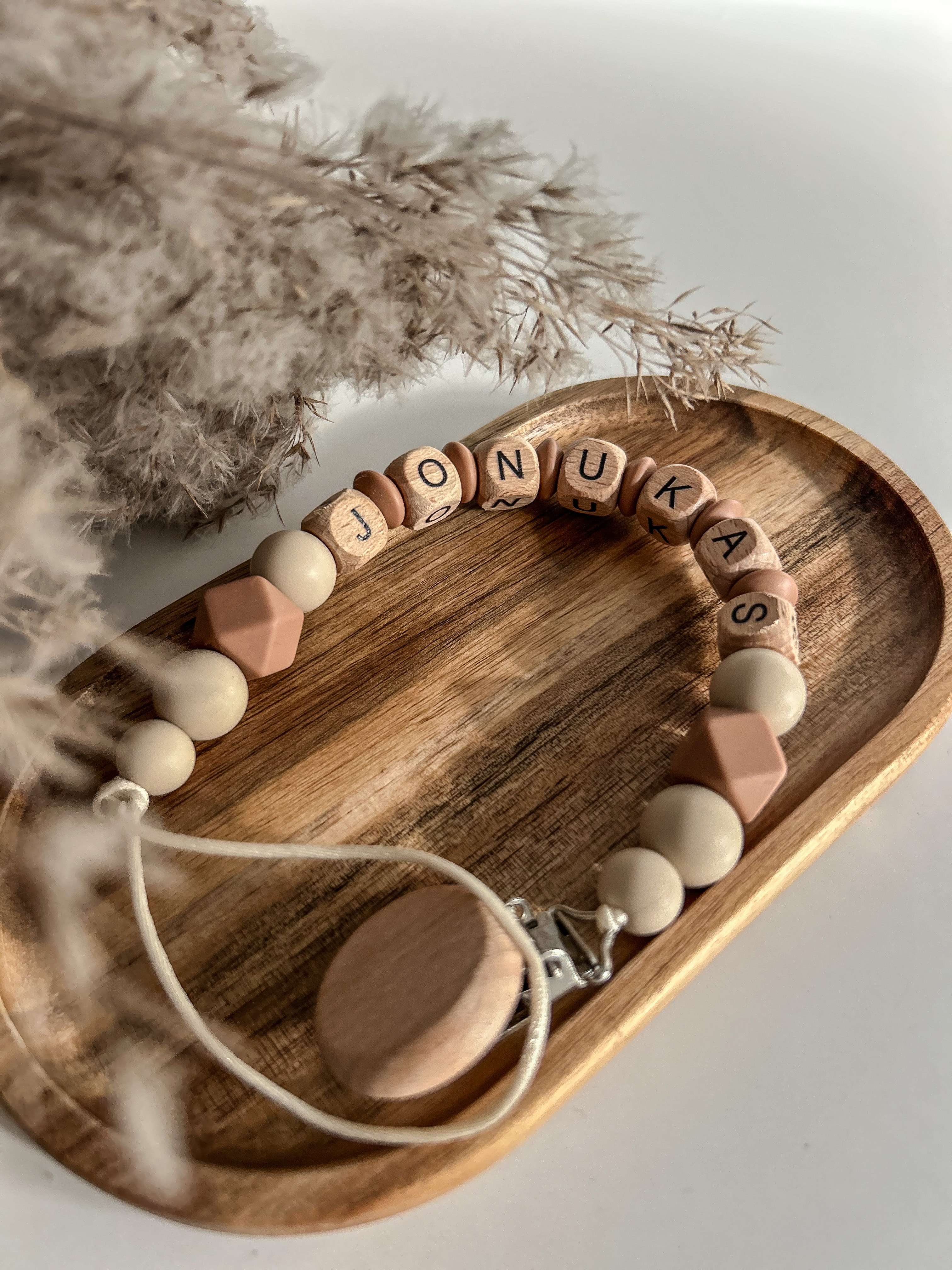 Čiulptuko laikiklis su vardu