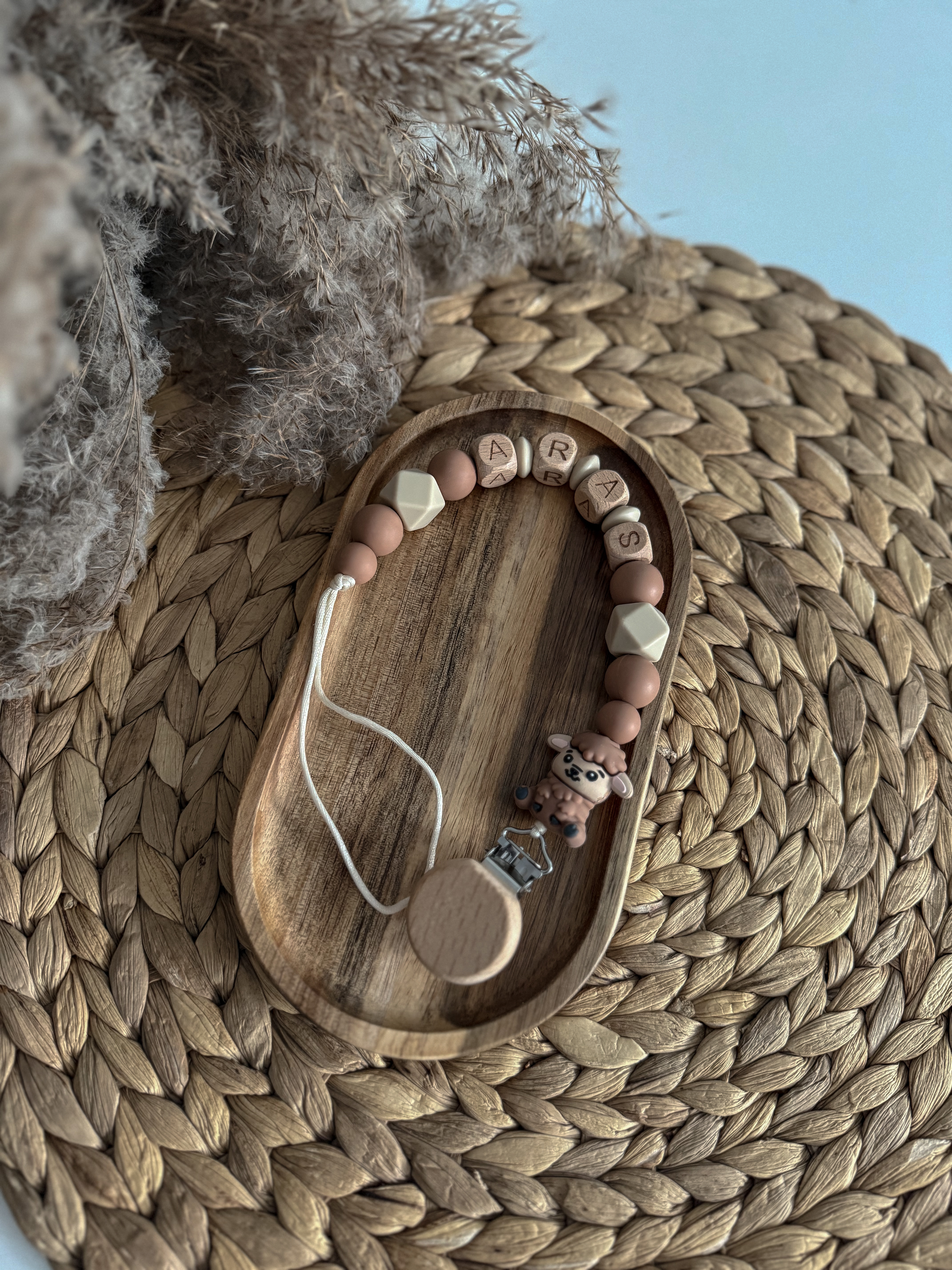 Čiulptuko laikiklis su vardu 