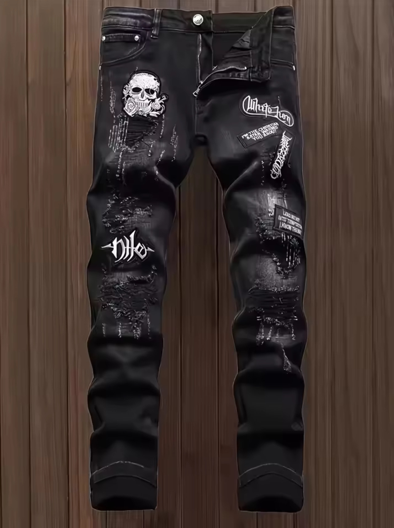 Black distressed graphic jeans