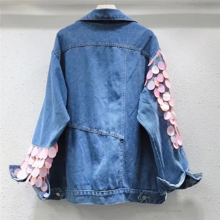 Denim jacket with pink appliqués