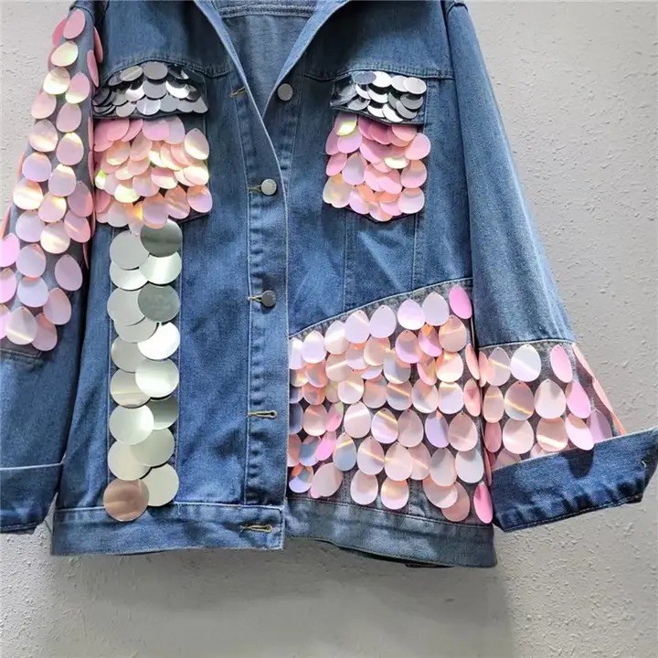 Denim jacket with pink appliqués