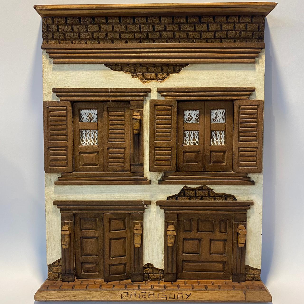 Fachada Colonial artesanal de madera