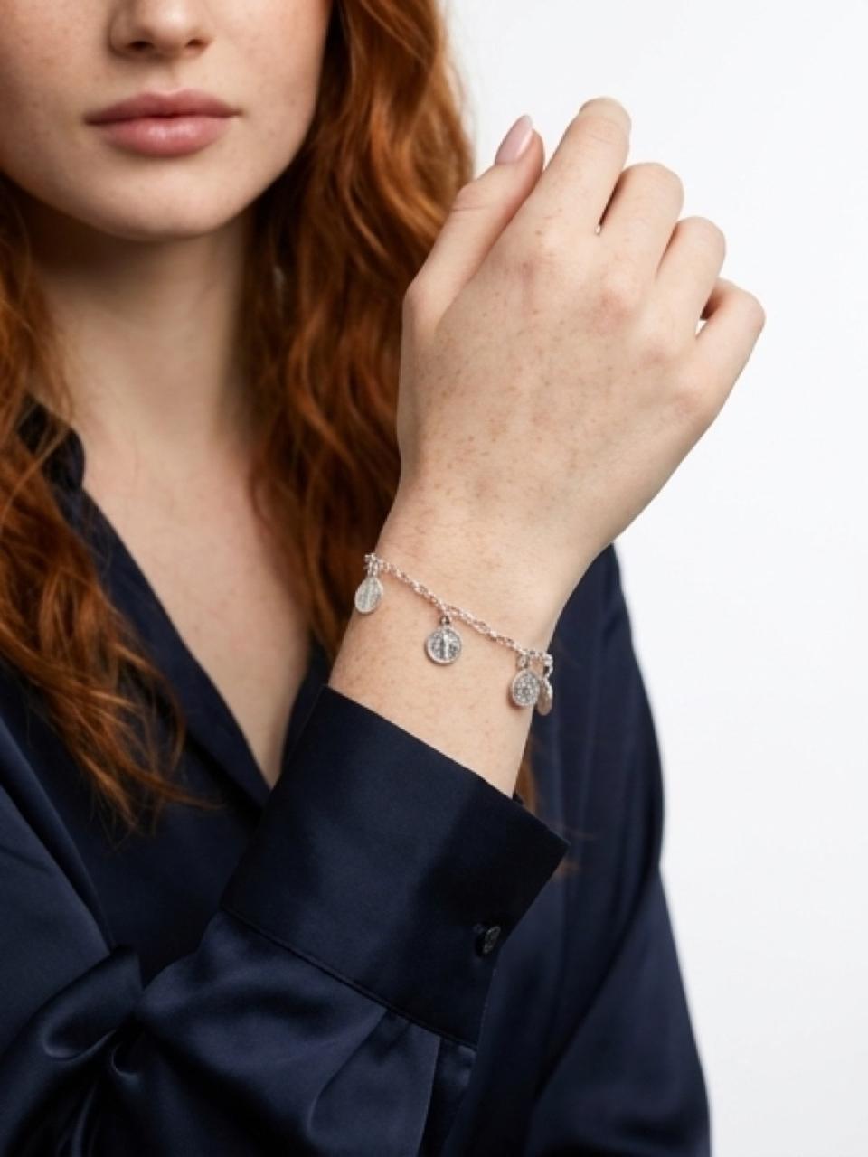 Silver bracelet with charms