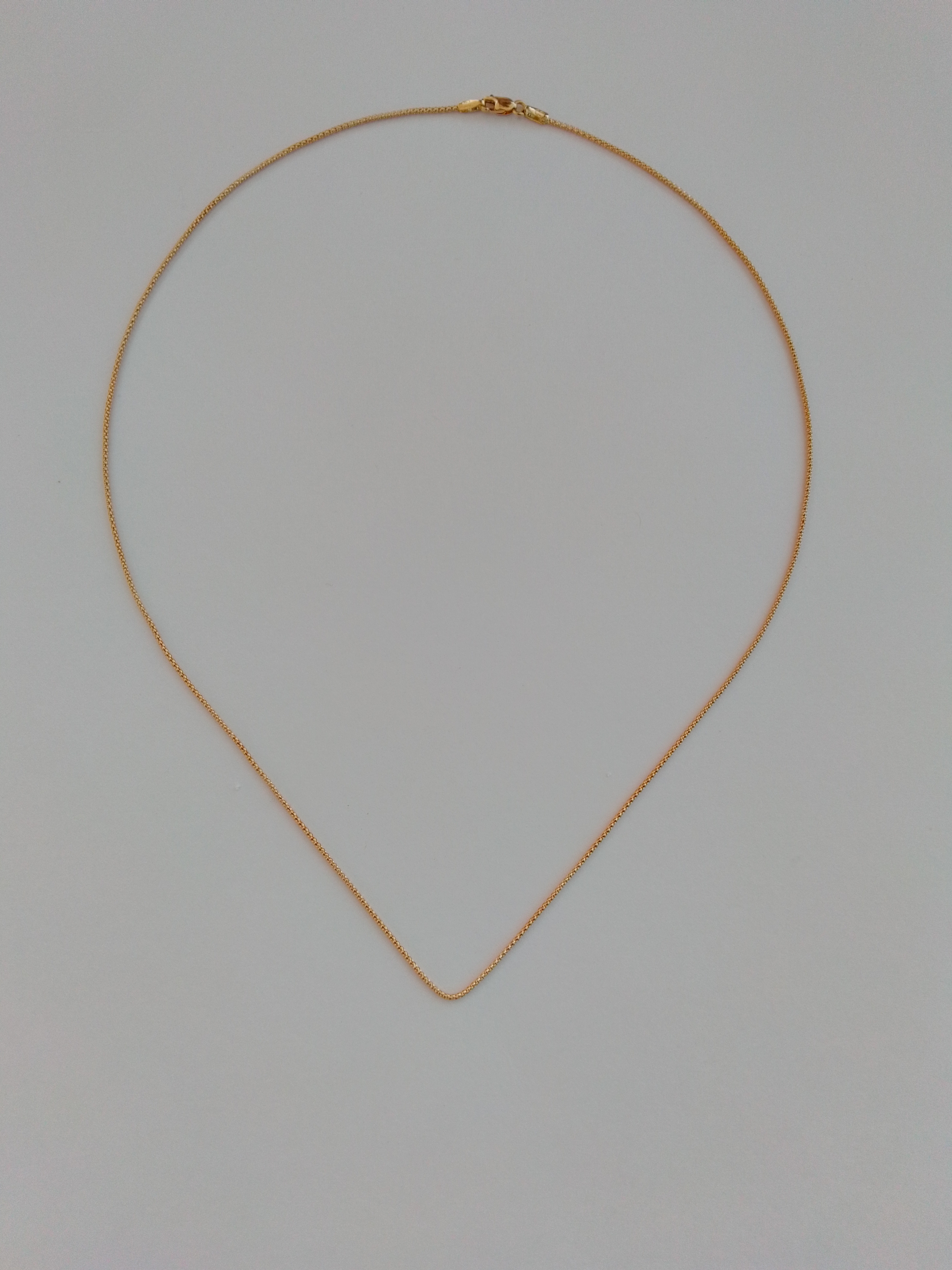 ROLLED-UP GOLD CHAIN NECKLACE