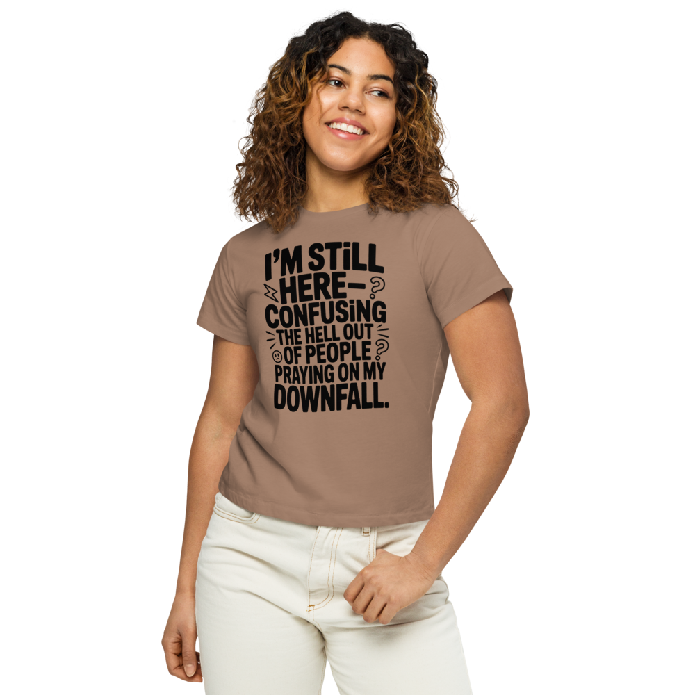 I’m still here—confusing the hell out of people praying on my downfall Statement Graphic Tee