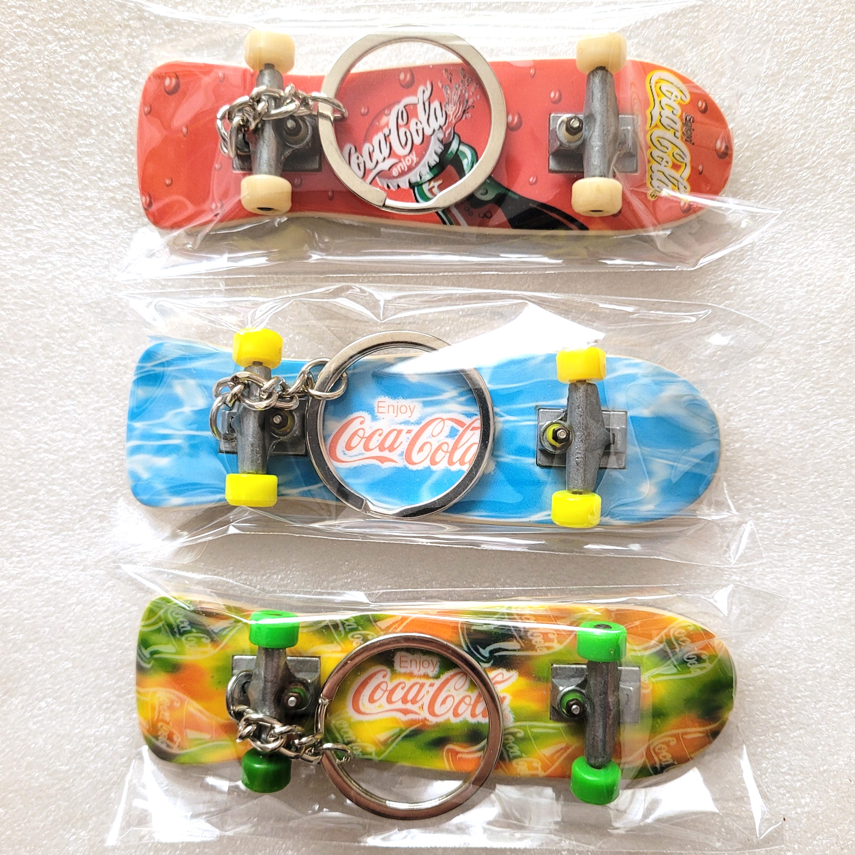 Coca Cola Mini Skateboard Keychains / Fingerboard Toys - 1990s Factory Sealed Hong Kong Exclusive