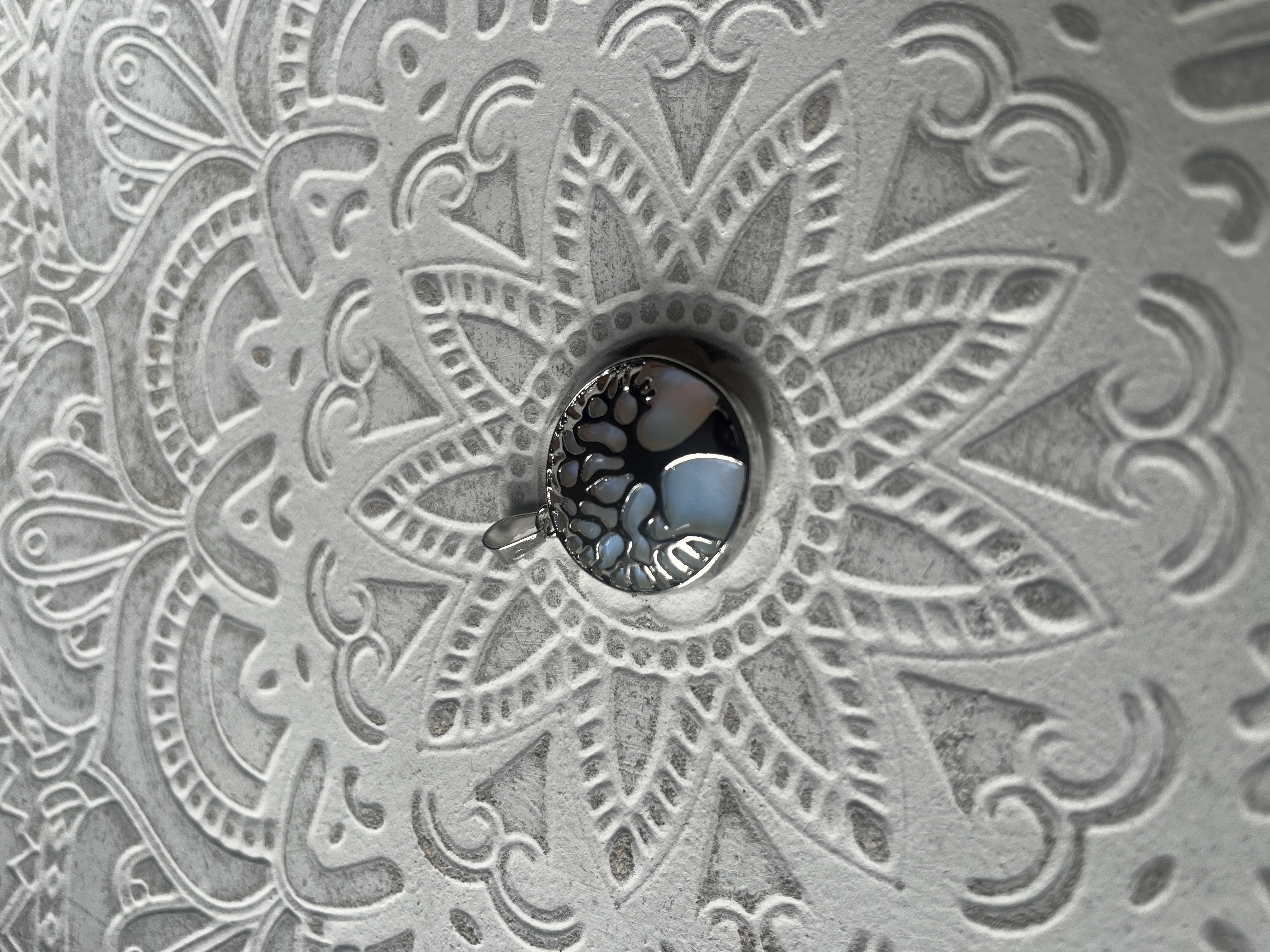 Decorative wall tile with embossed mandala pattern