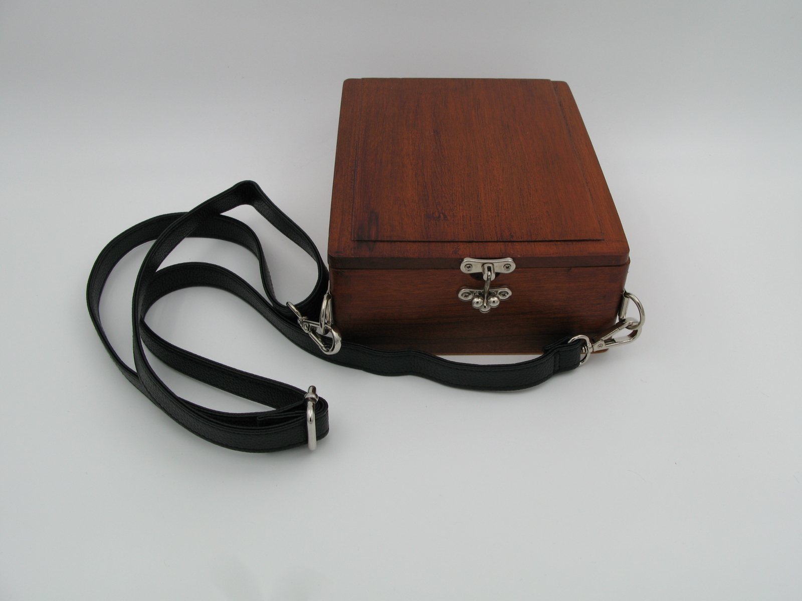 Wooden box with shoulder strap