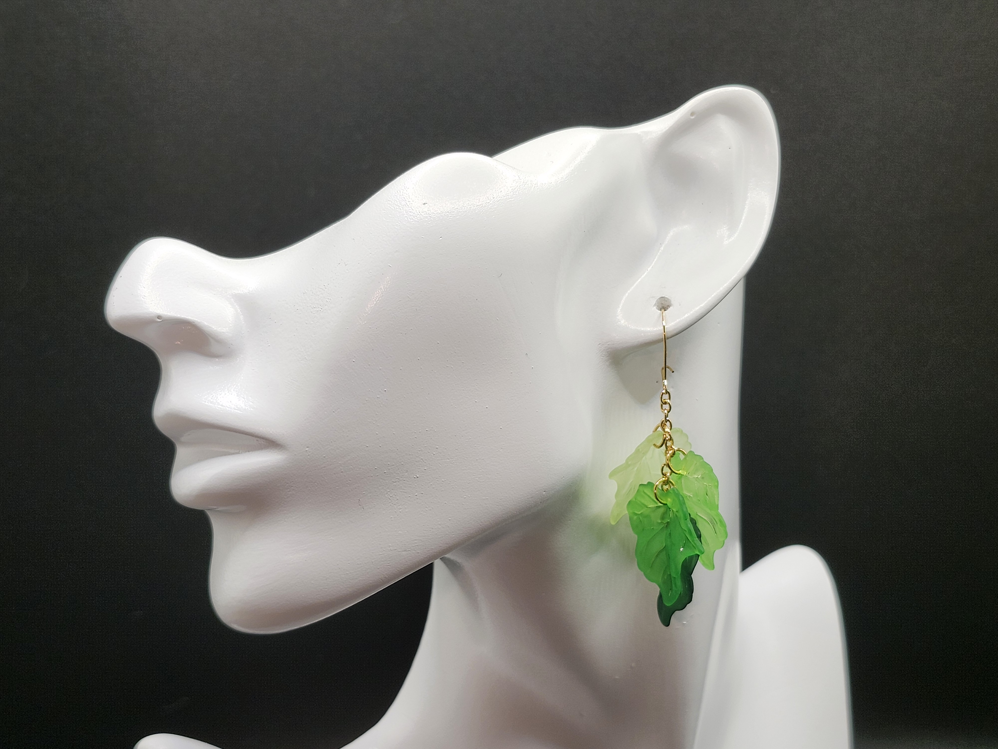 Handcrafted green leaf dangle earrings with gold chain accents. Lightweight, nature-inspired hypoallergenic jewelry