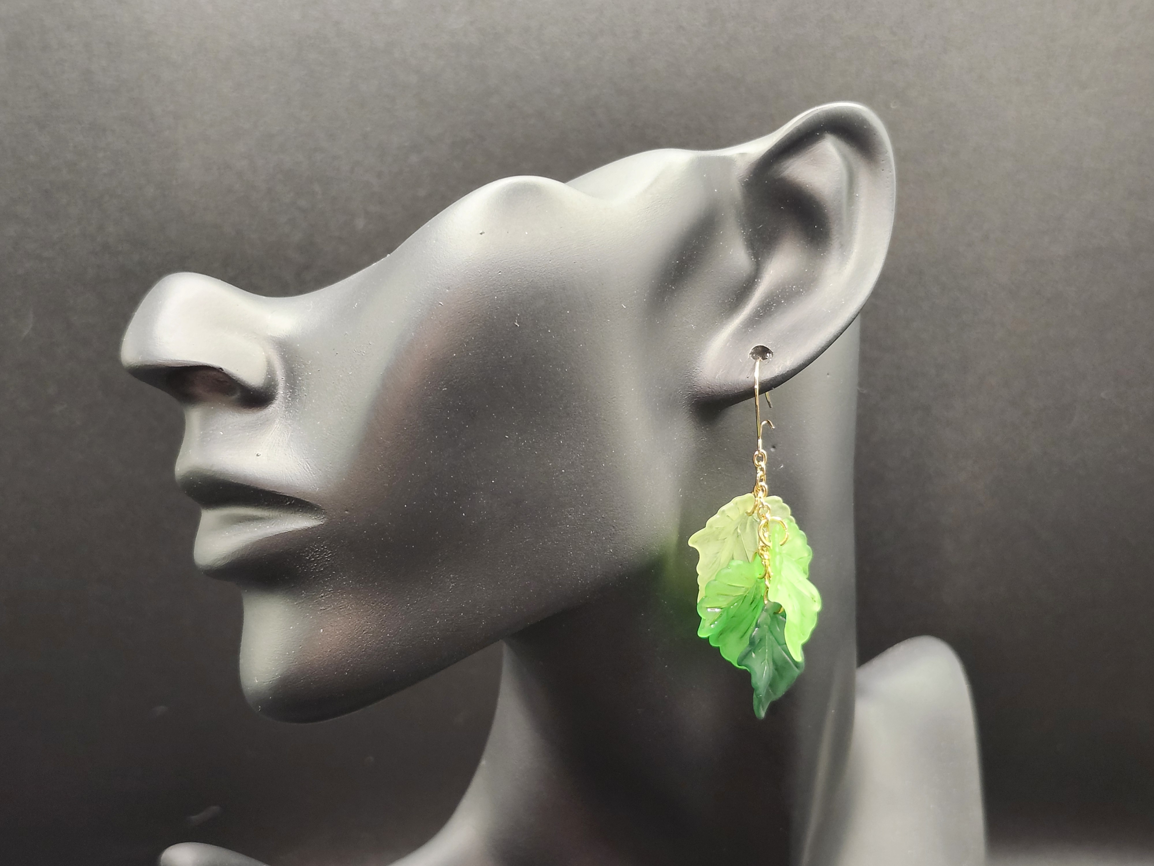 Handcrafted green leaf dangle earrings with gold chain accents. Lightweight, nature-inspired hypoallergenic jewelry
