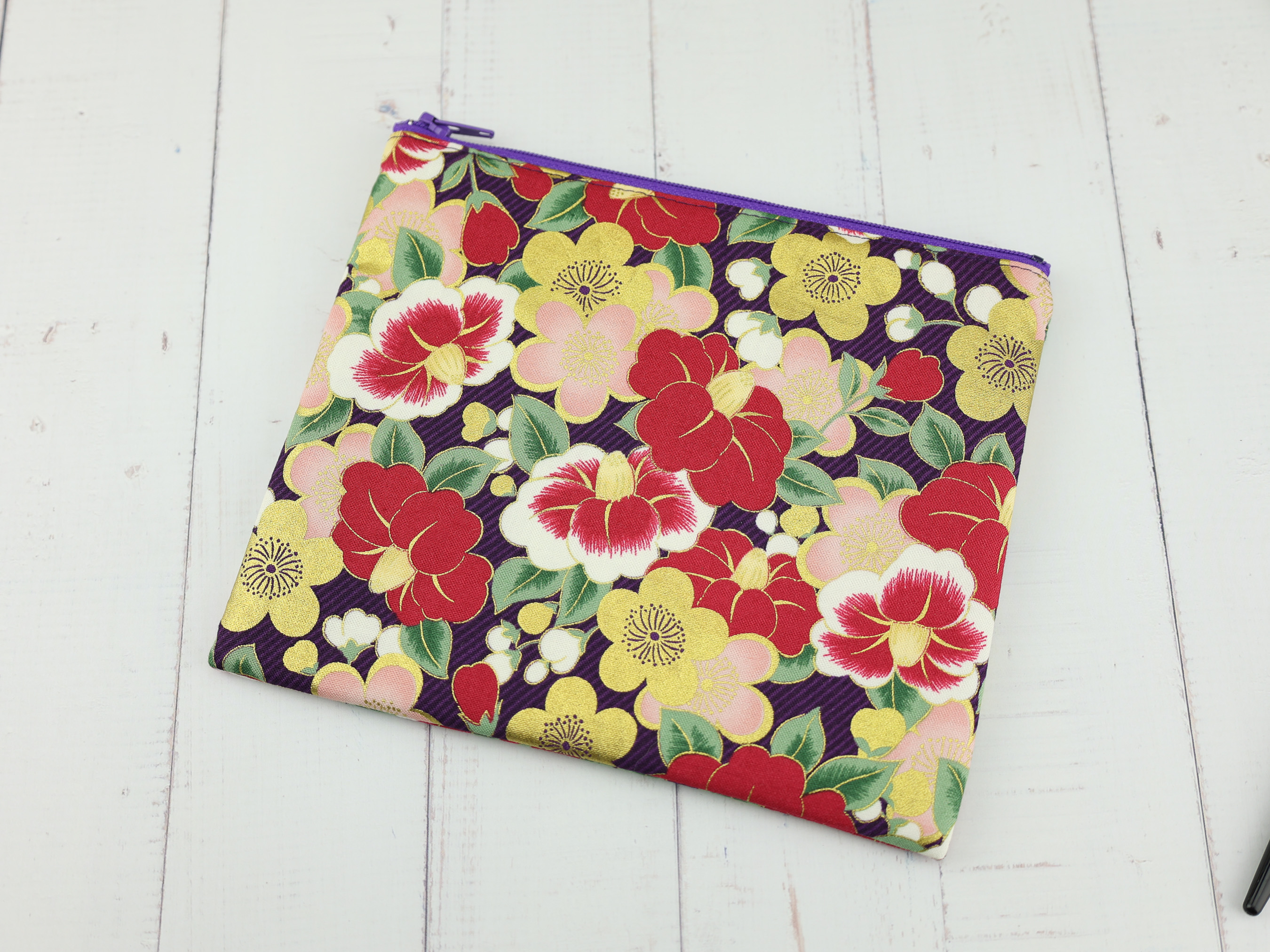 Purple Camellia Pouch – Japanese Zipper Bag with Red and Gold Tsubaki Flowers on Dark Background