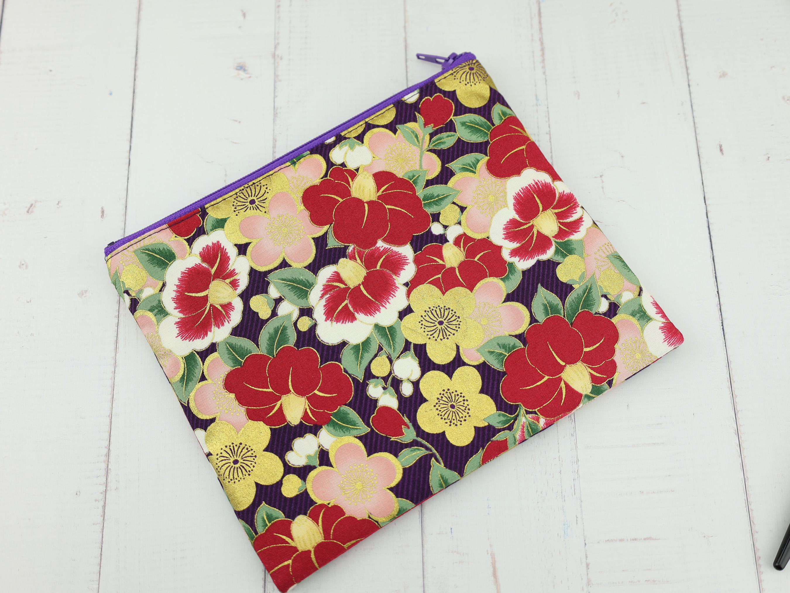 Purple Camellia Pouch – Japanese Zipper Bag with Red and Gold Tsubaki Flowers on Dark Background