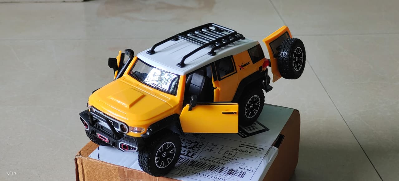 Yellow Toy SUV Car Model