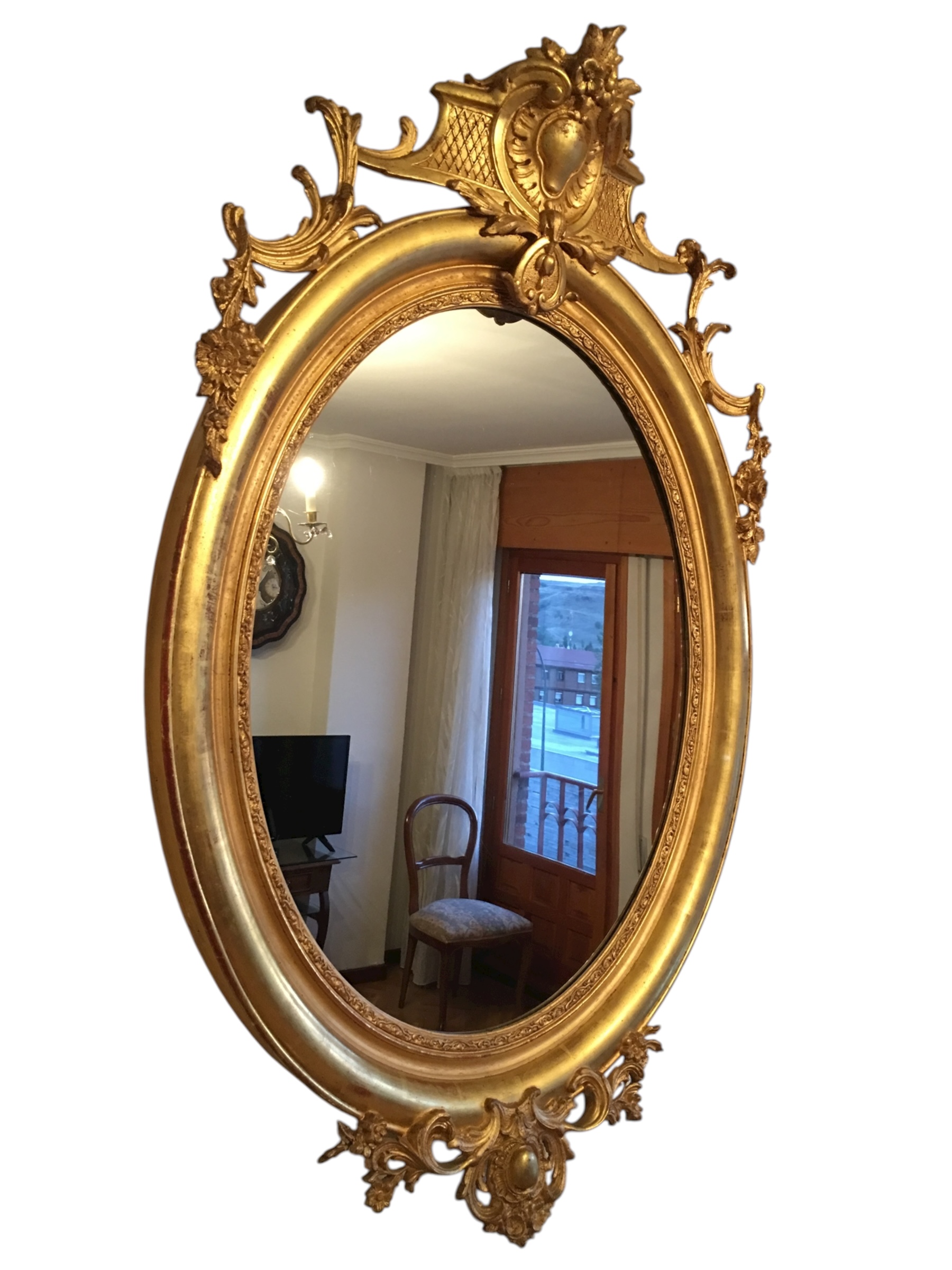 Gran espejo ovalado y dorado al pan de oro, s.XIX.