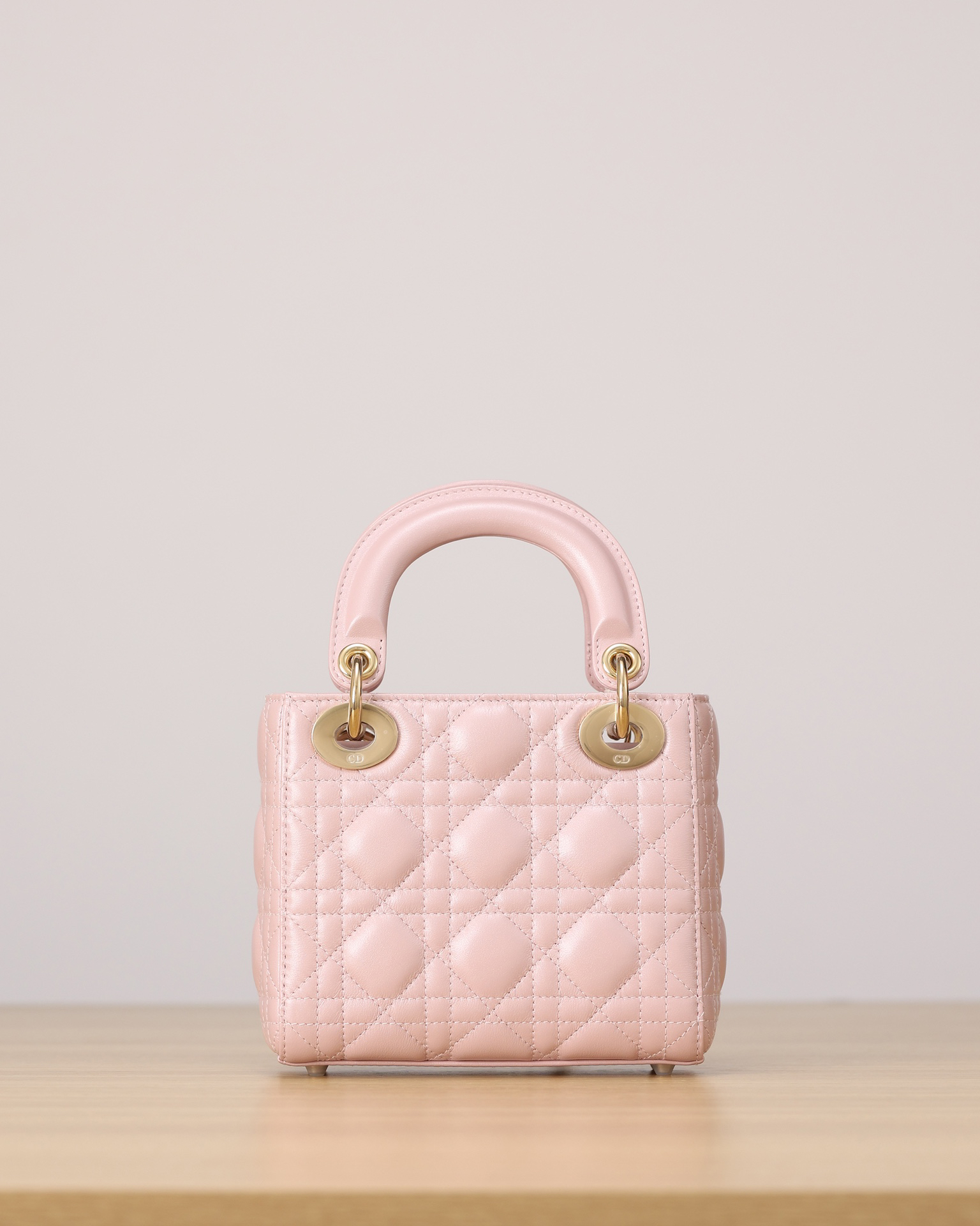 DIOR Lady Dior Three-pocket Duchess bag, pearlized pink sheepskin, gold snap buttons