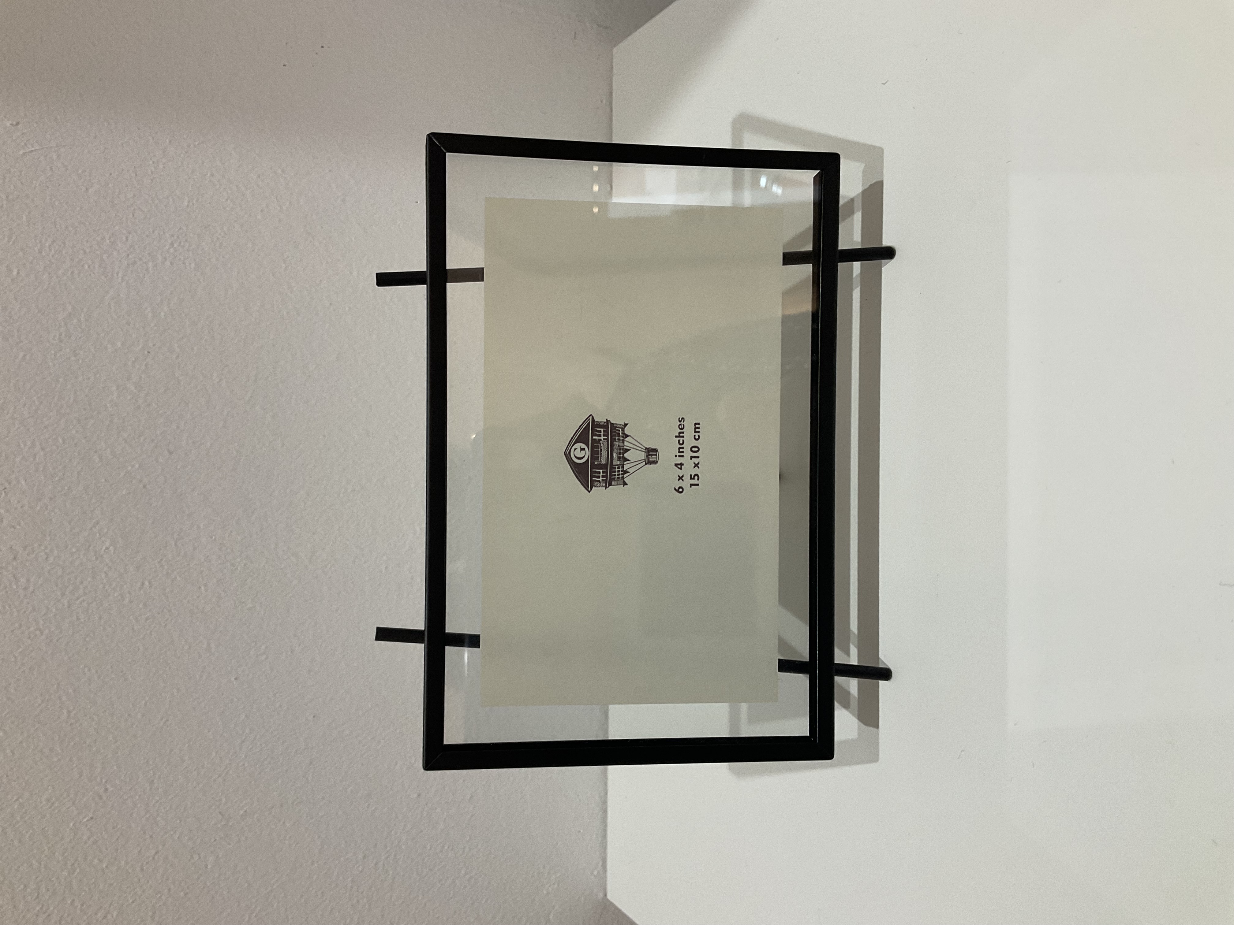 Portarretratos de vidrio y metal