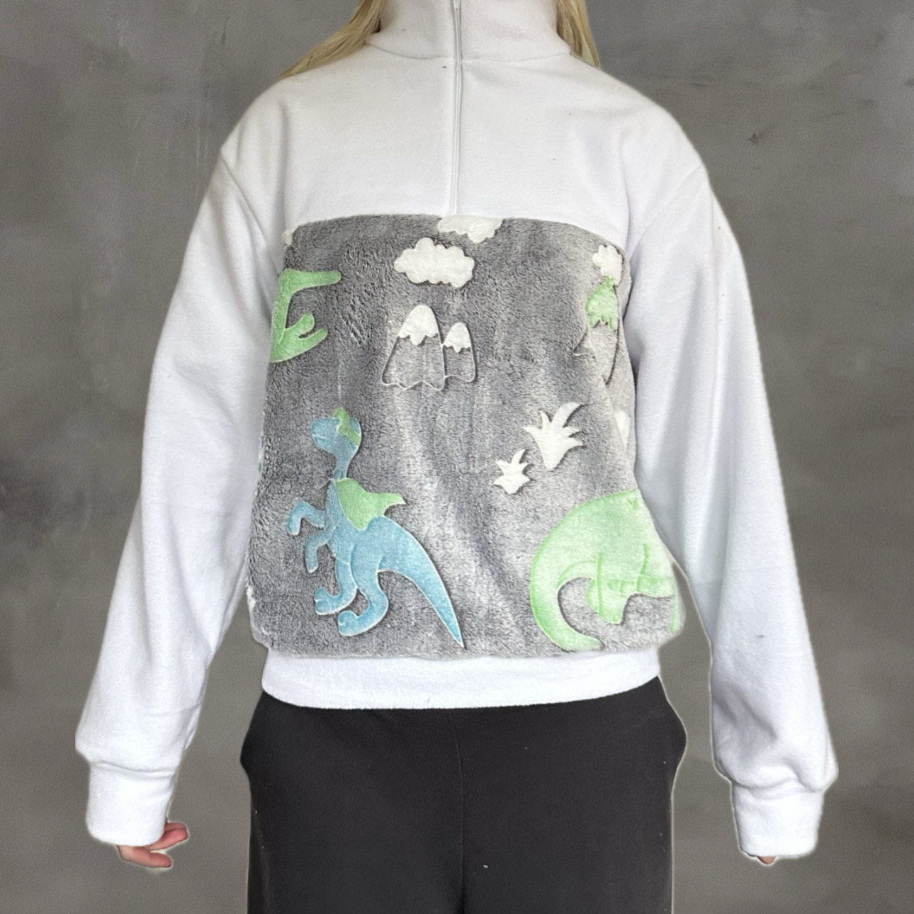 Witte trui met dinosaurussen