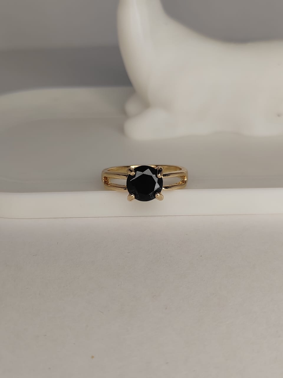 Gold ring with black gemstone
