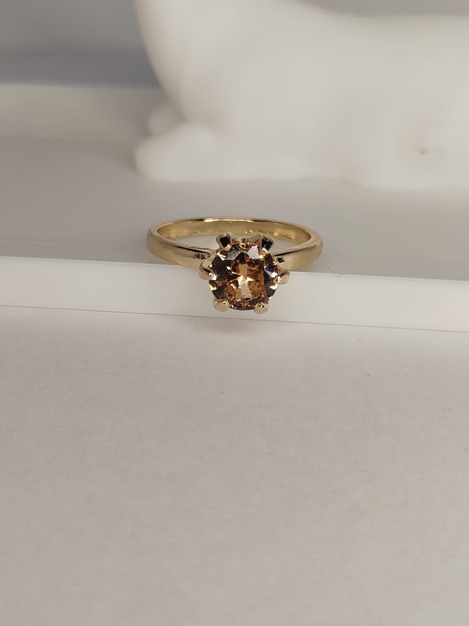 Elegant gold ring with brown gemstone