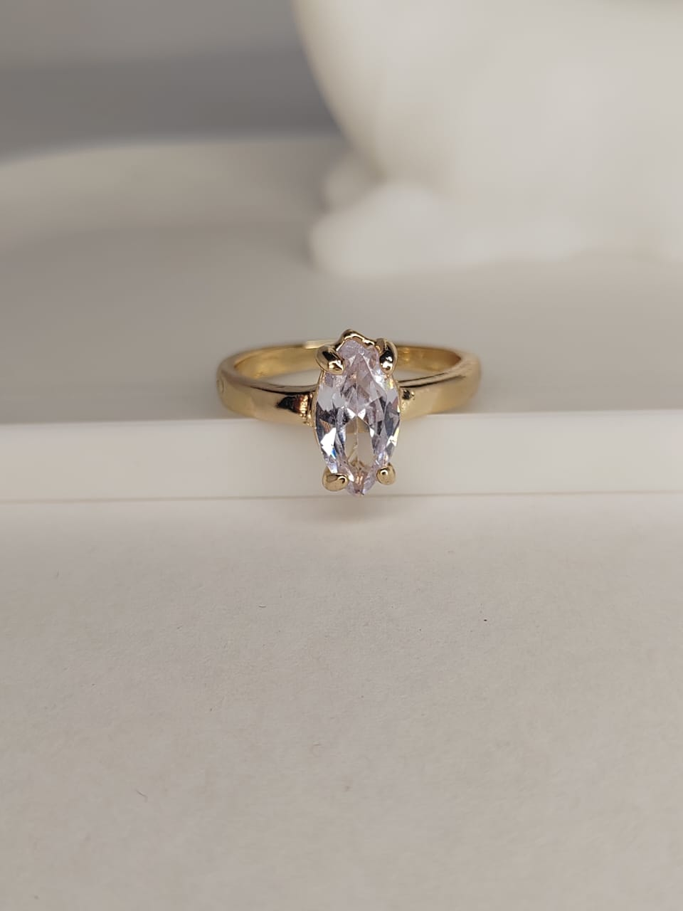 Elegant gold ring with marquise-cut crystal