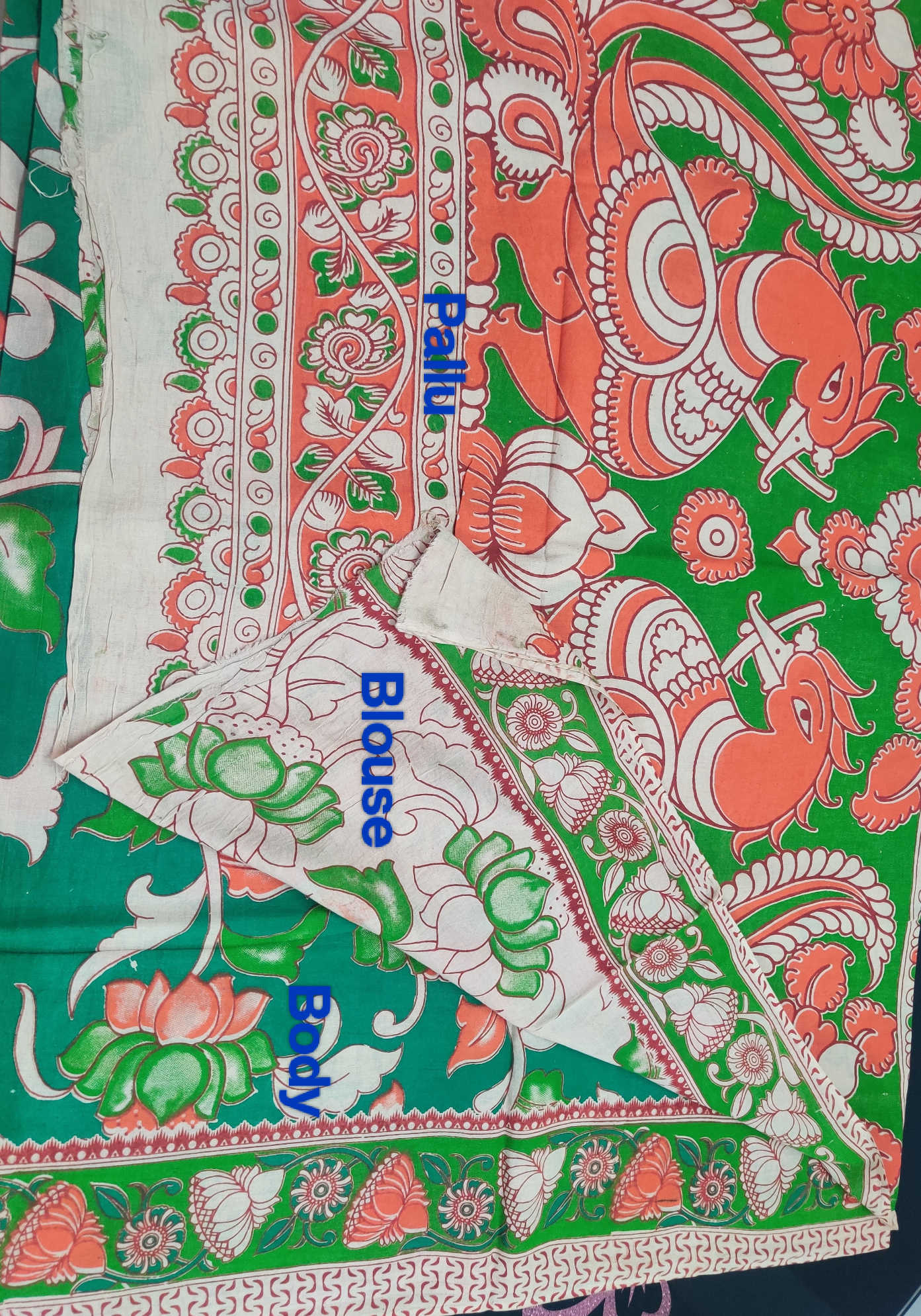 Kalamkari Cotton Saree – Green Body with Orange–White Floral Motifs & Traditional Kalamkari Bird Pallu