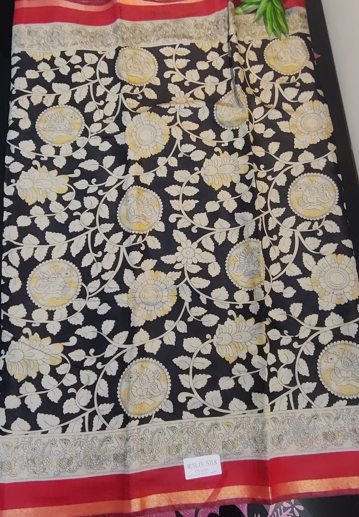 Kalamkari Muslin Silk Saree – Vibrant Green Base with Pink–Orange Floral Body & Traditional Kalamkari Peacock Border