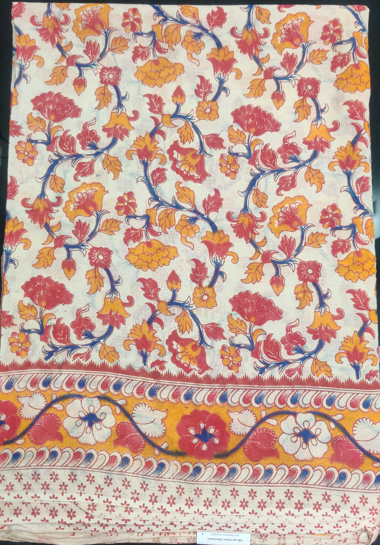 Kalamkari Cotton Saree – Cream Base with Red & Mustard Floral Body & Traditional Kalamkari Pallu