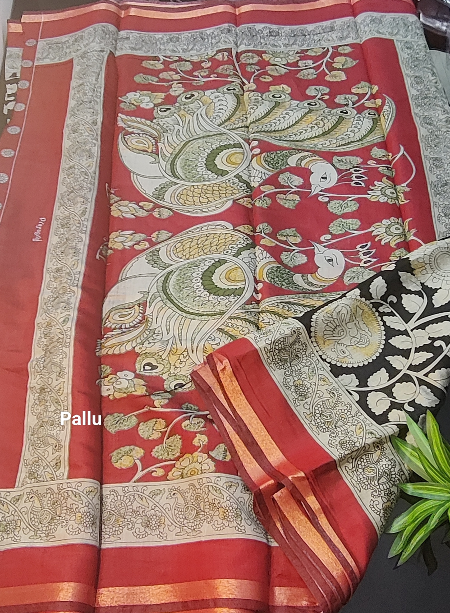 Kalamkari Muslin Silk Saree – Vibrant Green Base with Pink–Orange Floral Body & Traditional Kalamkari Peacock Border